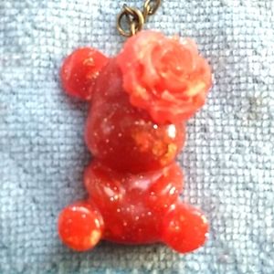 Hand made red  keychain  shaped like a bear with a rose sitting on it's head